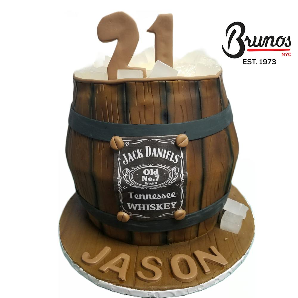 a cake sitting on top of a barrel