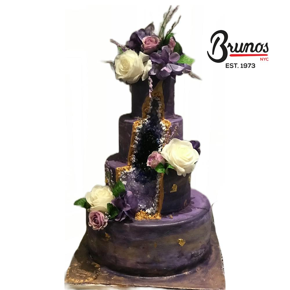a cake sitting on top of a flower