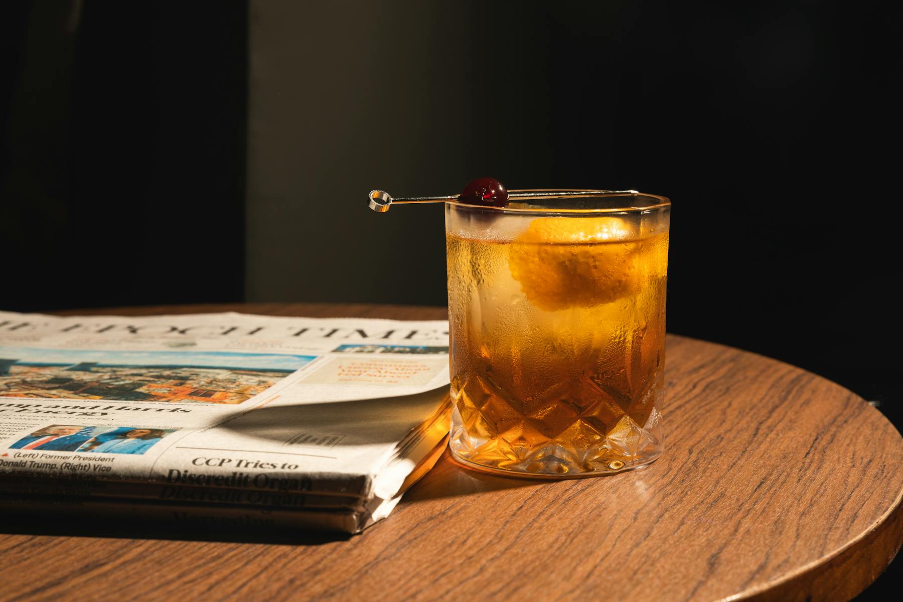 a cup of coffee sitting on top of a wooden table