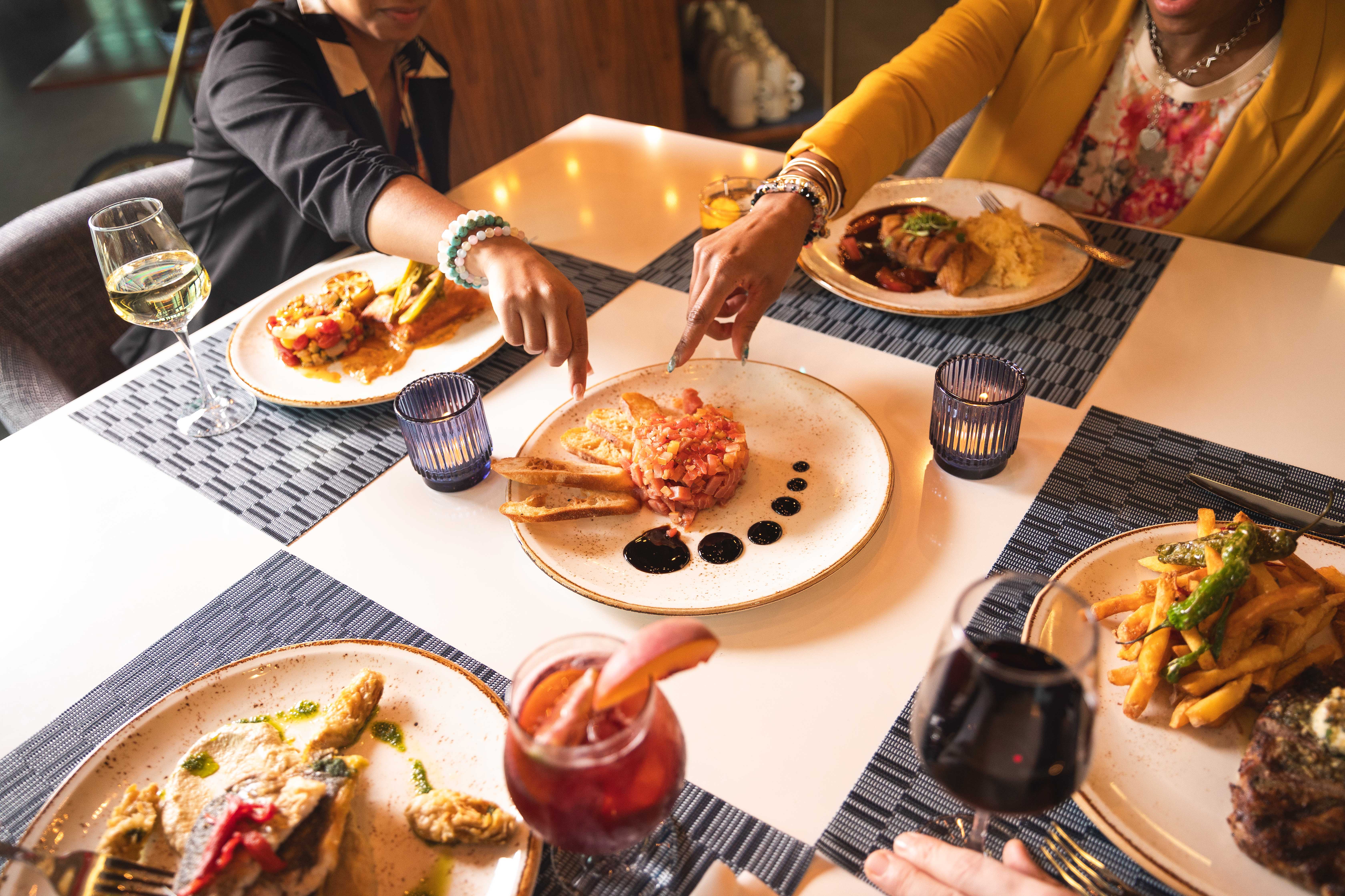 different plates with food and wine