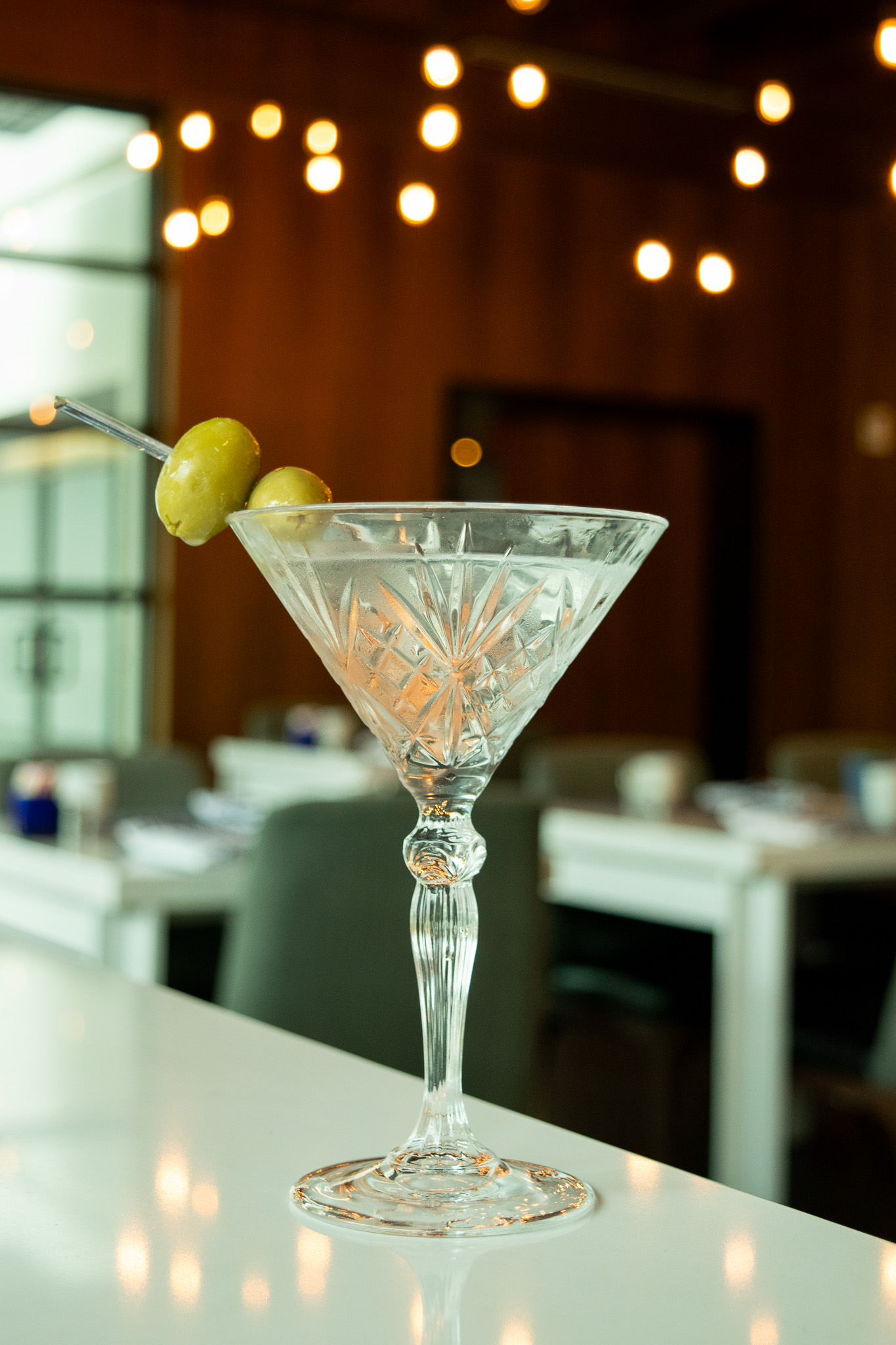 Dirty martini on a white countertop at Portico Atlanta
