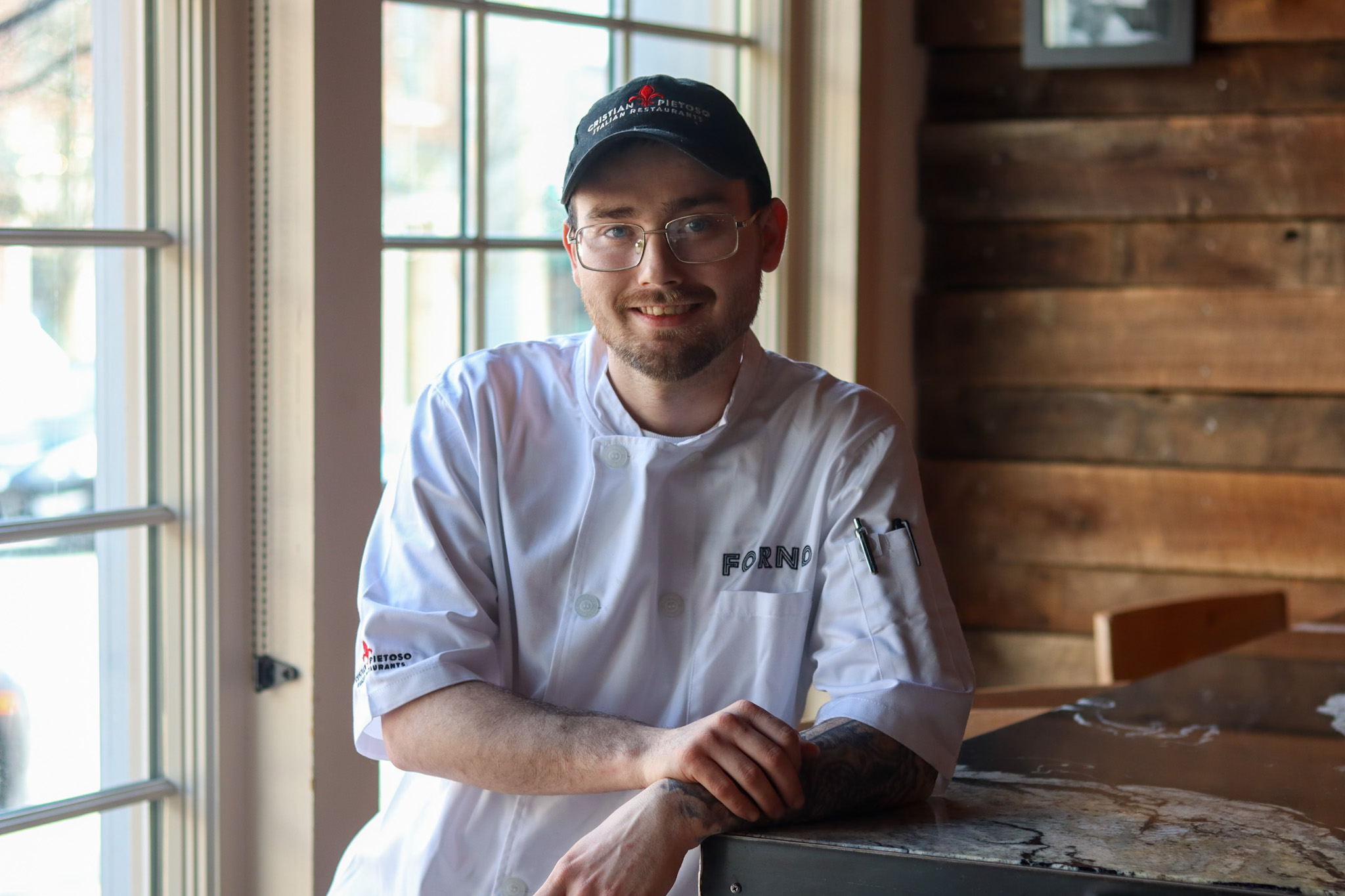 Professional headshot of a staff member at Forno Osteria & Bar.