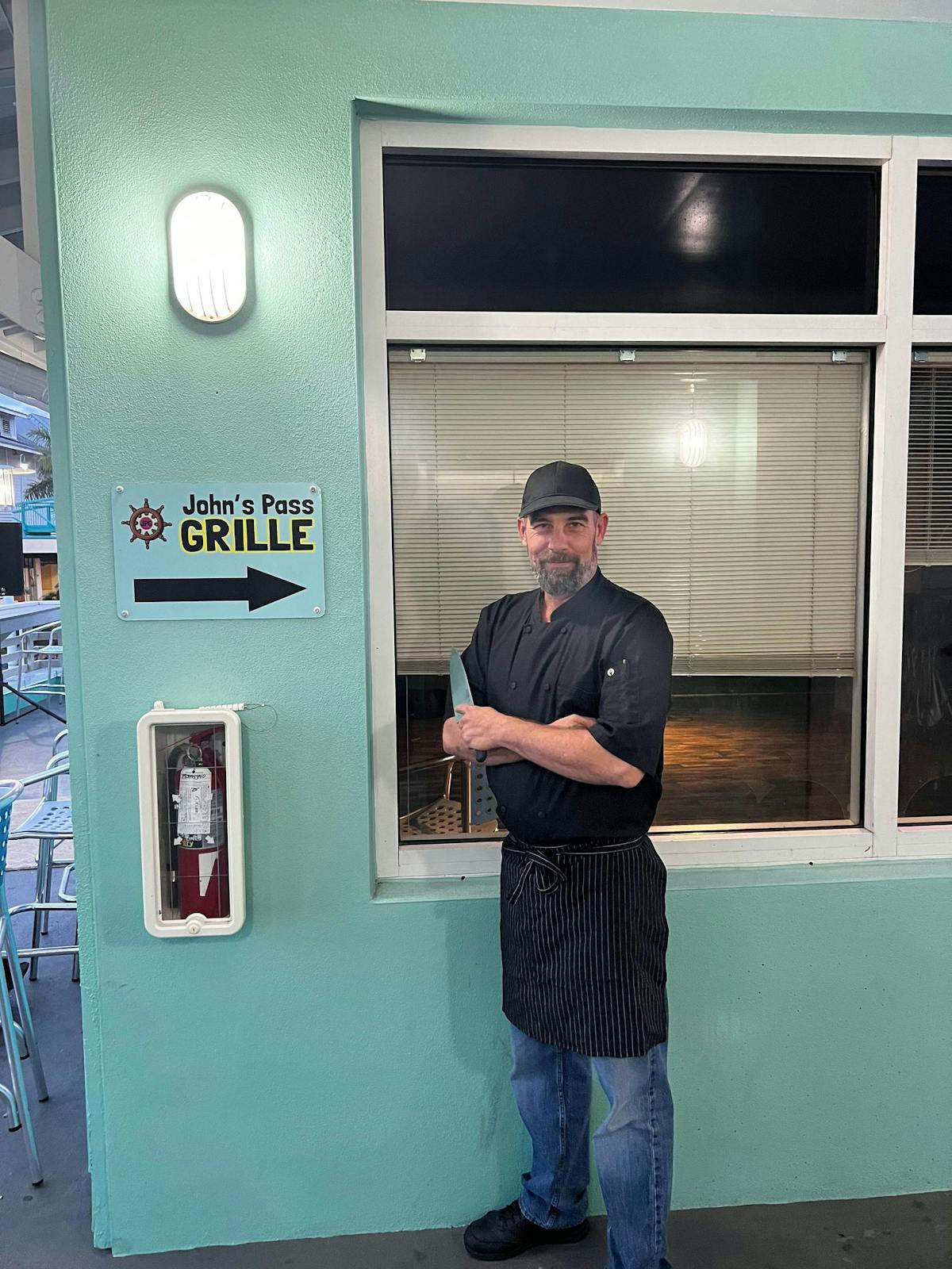 a man standing in front of a window