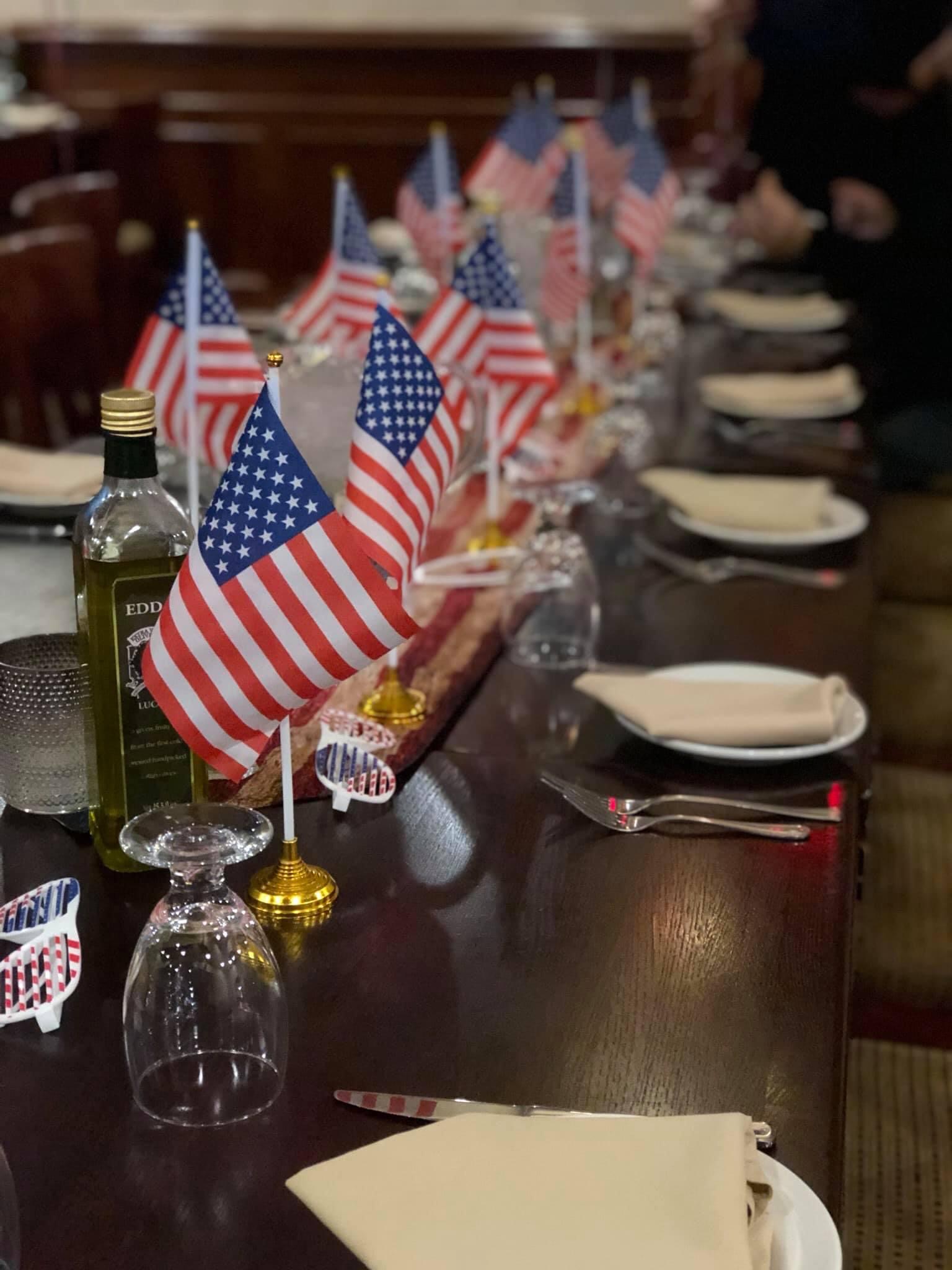 a person sitting at a table in a restaurant
