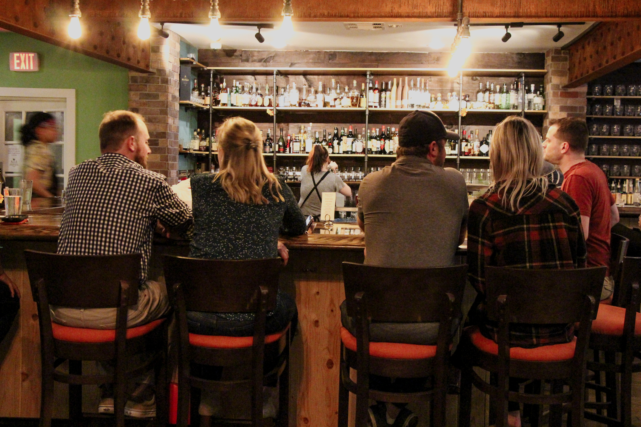 guests seated at the bar