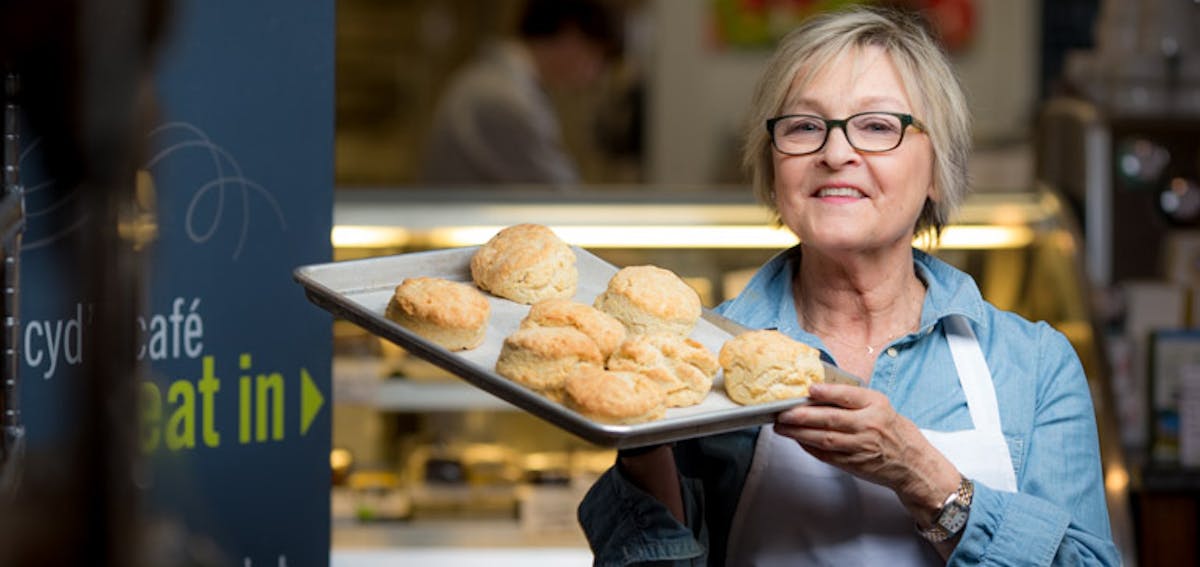 a woman holding a plate of food