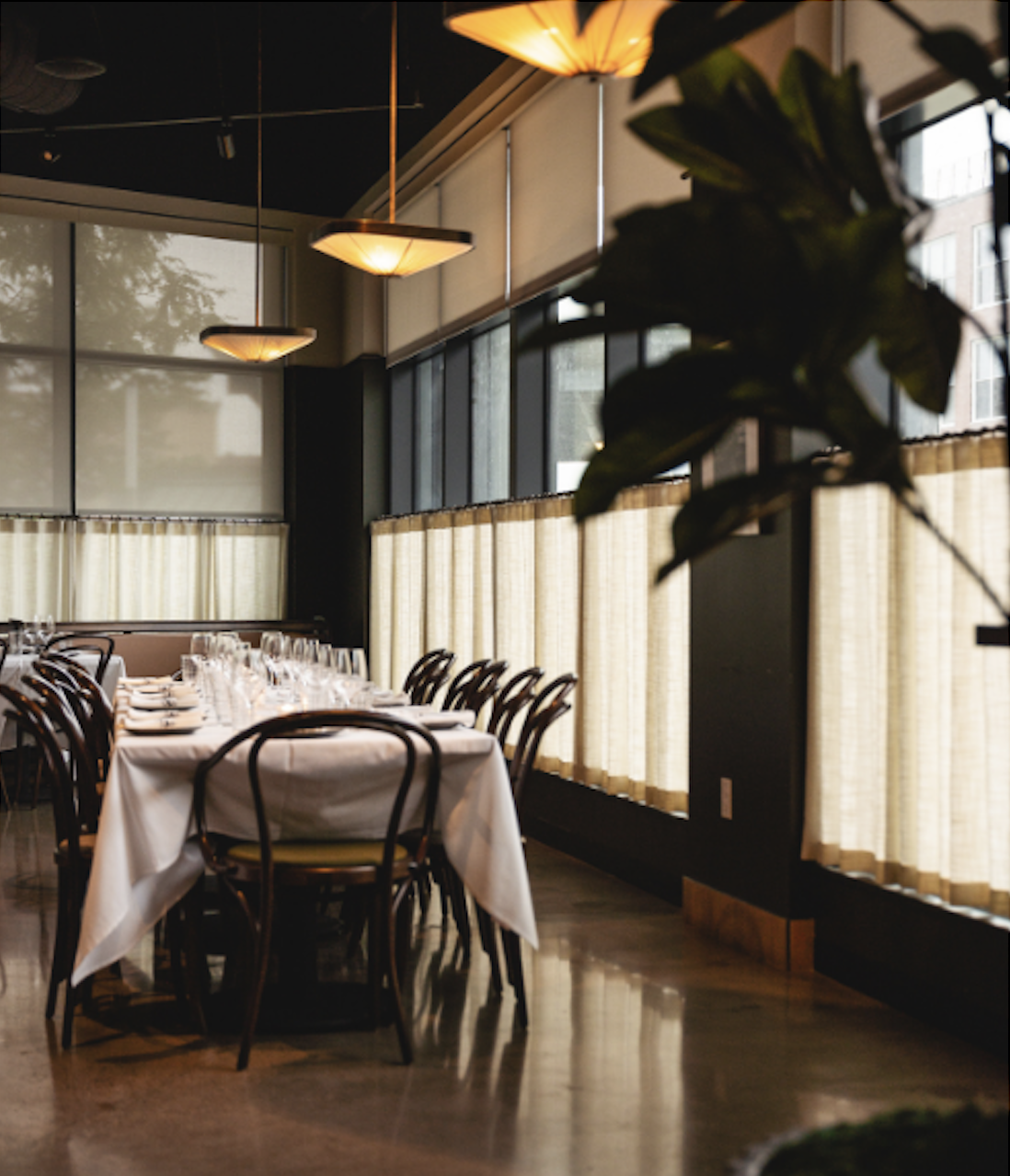 a room filled with furniture and a large window