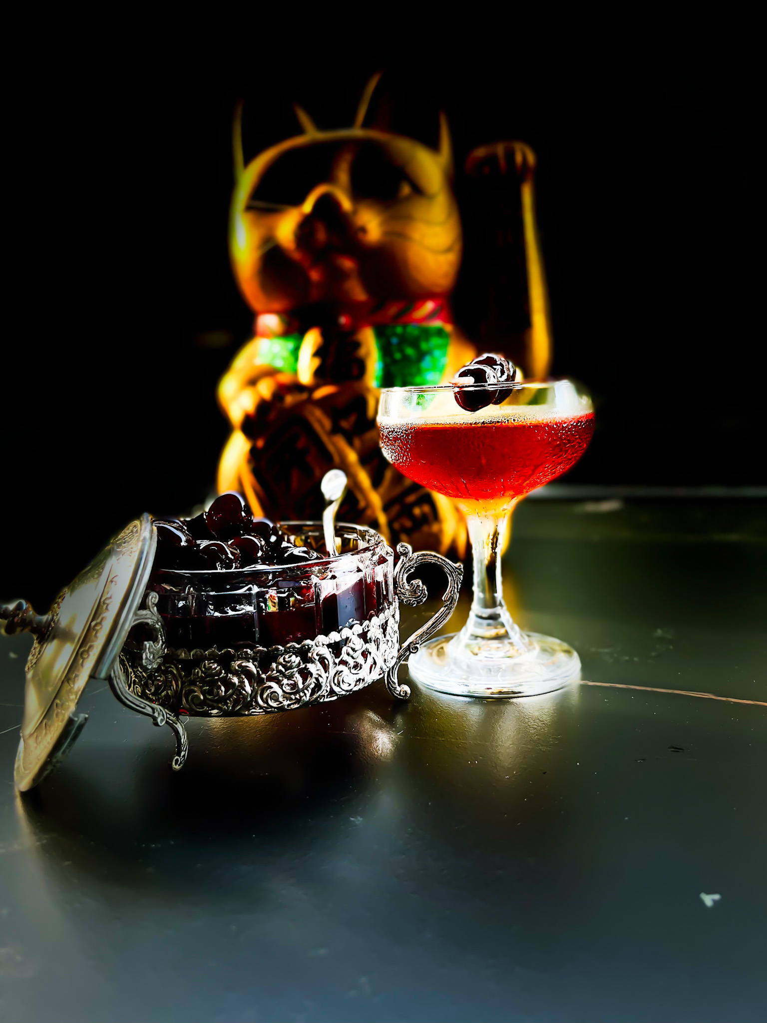 a maneki neko and a manhattan