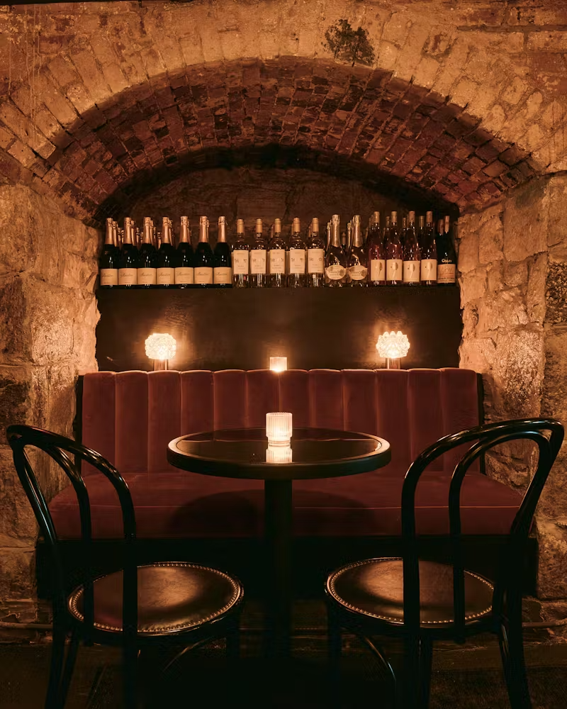 a fire place sitting in a dark room