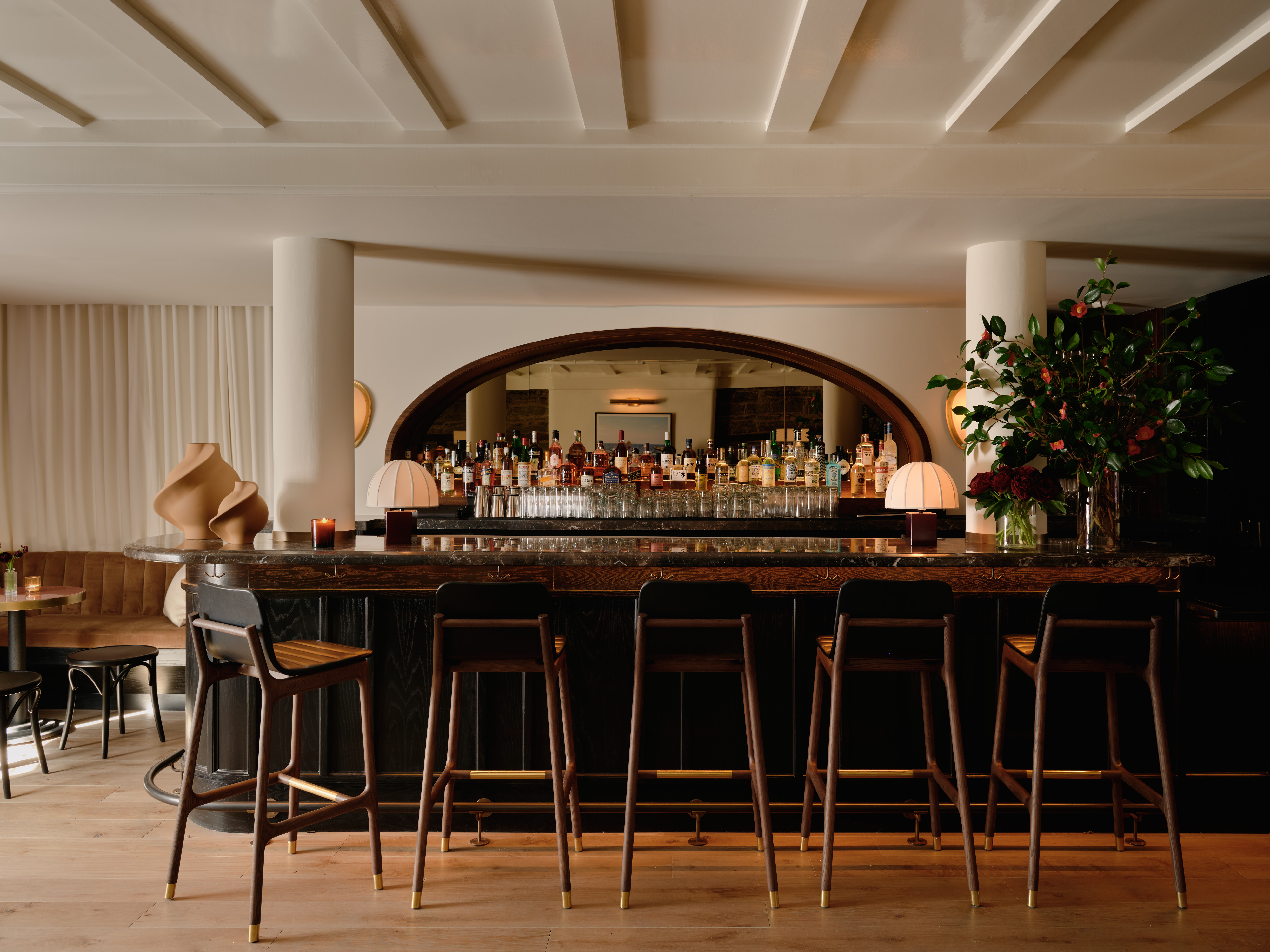 an elegant bar display lined with bar seats