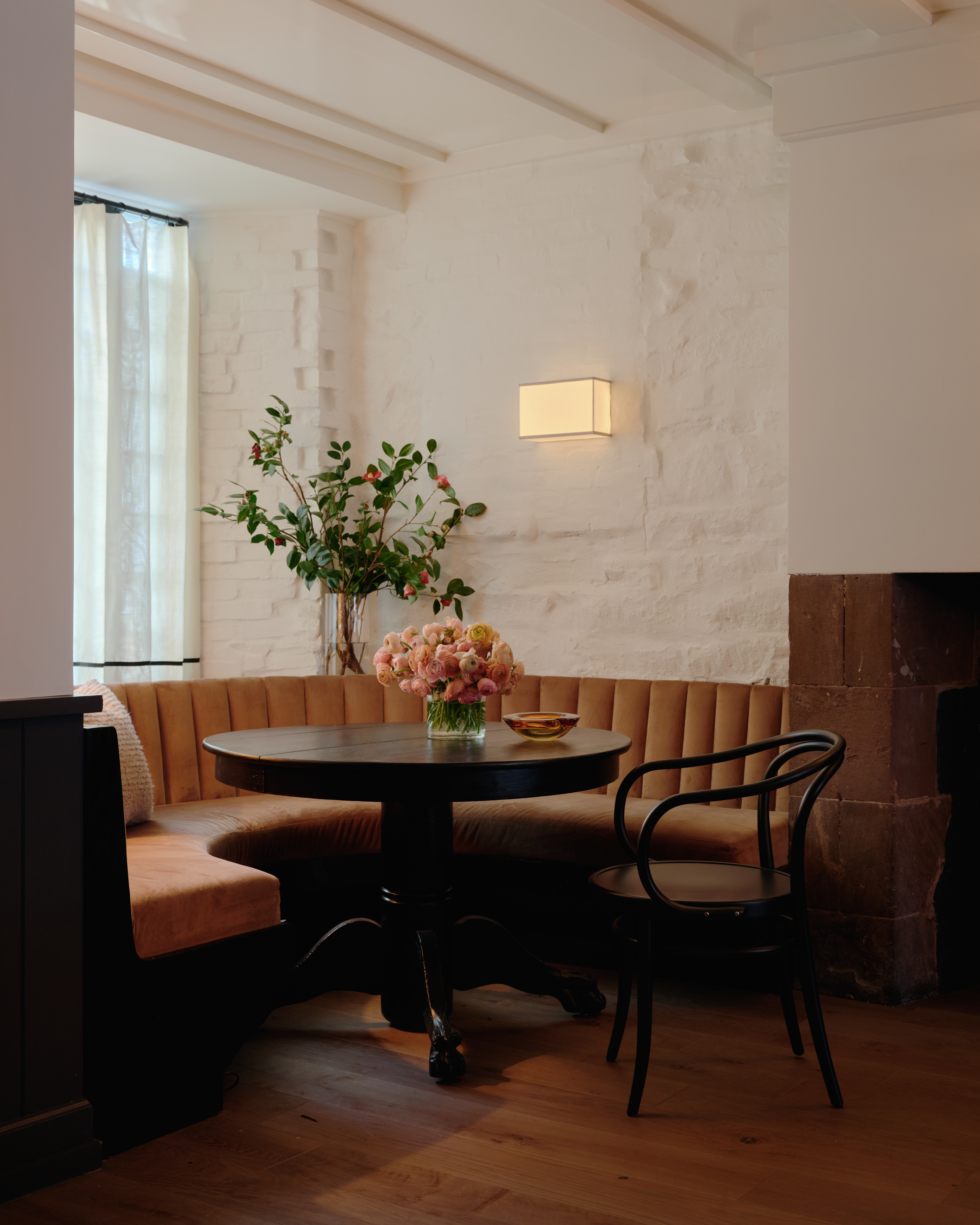 a living room filled with furniture and a large window