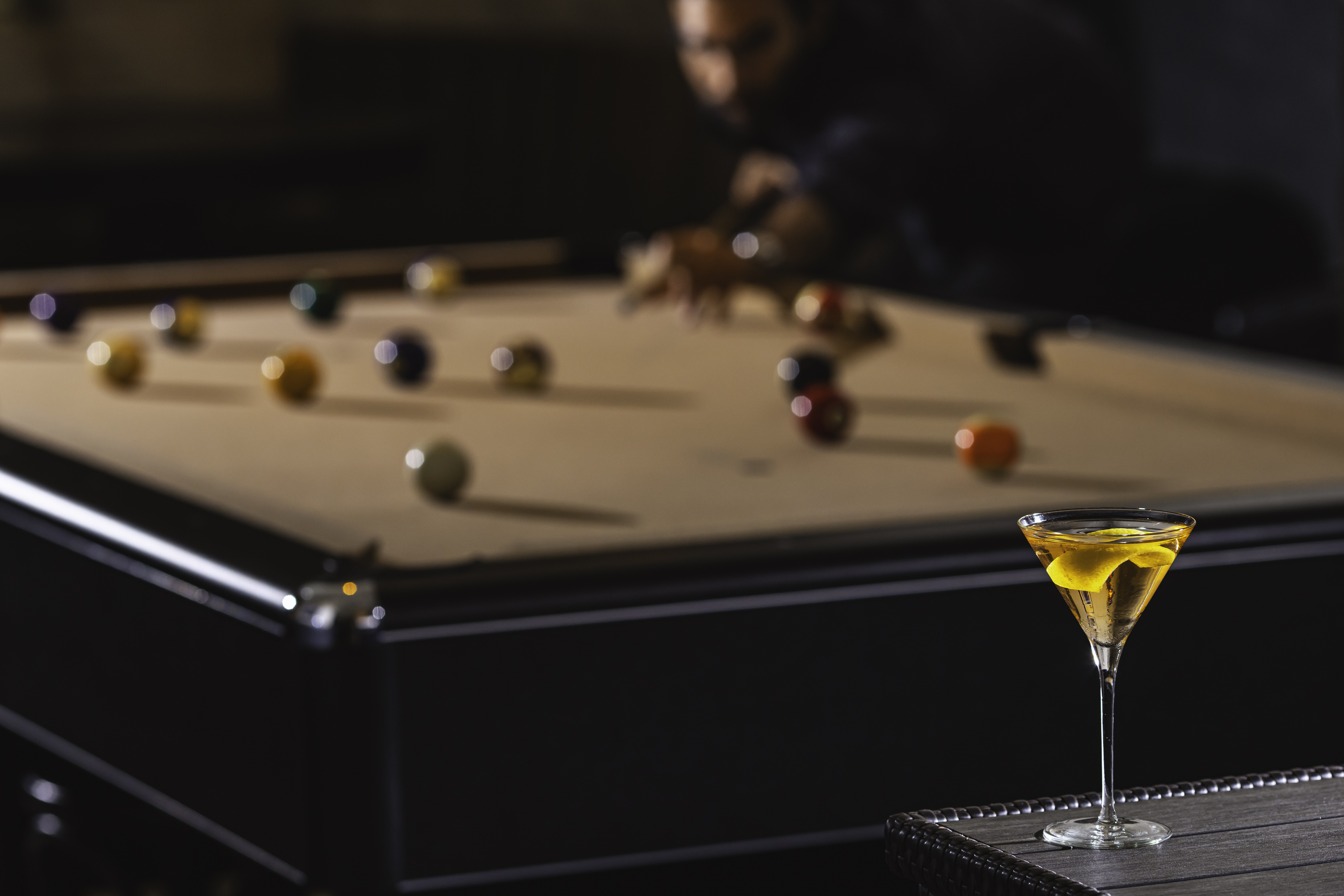 a whiskey martini with pool table