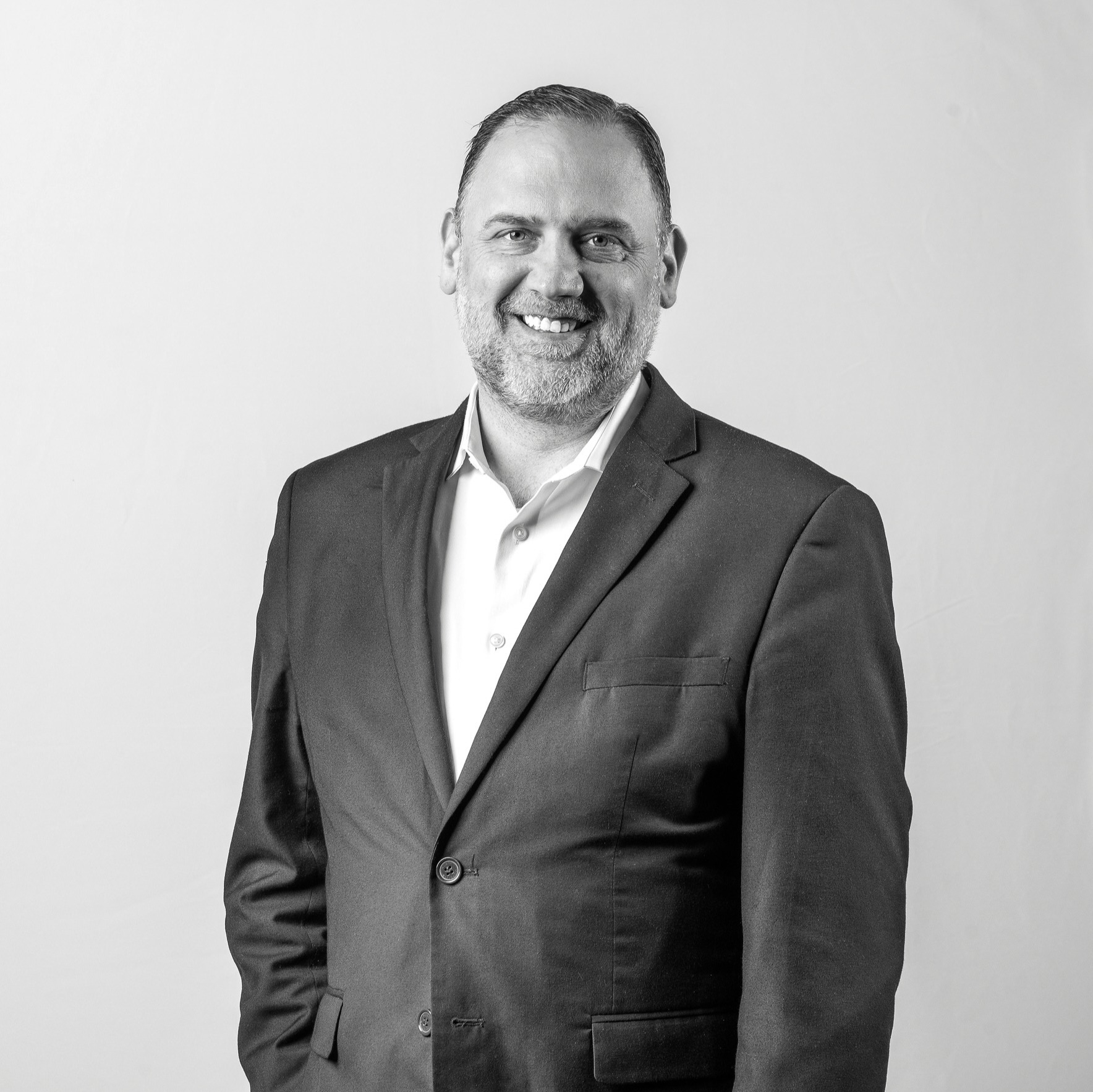 a person smiling at the camera.