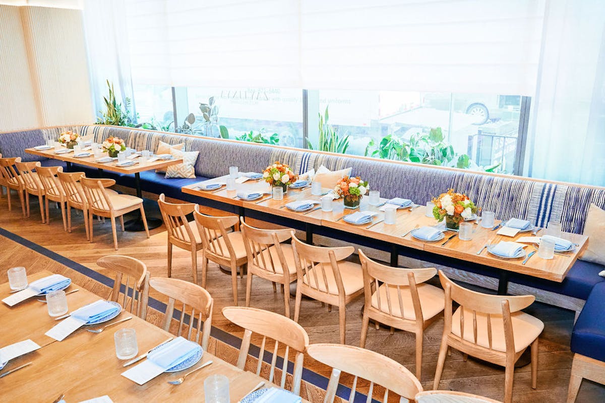 a dining room table in front of a window