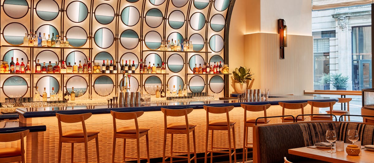 a vibrant restaurant with brown chairs