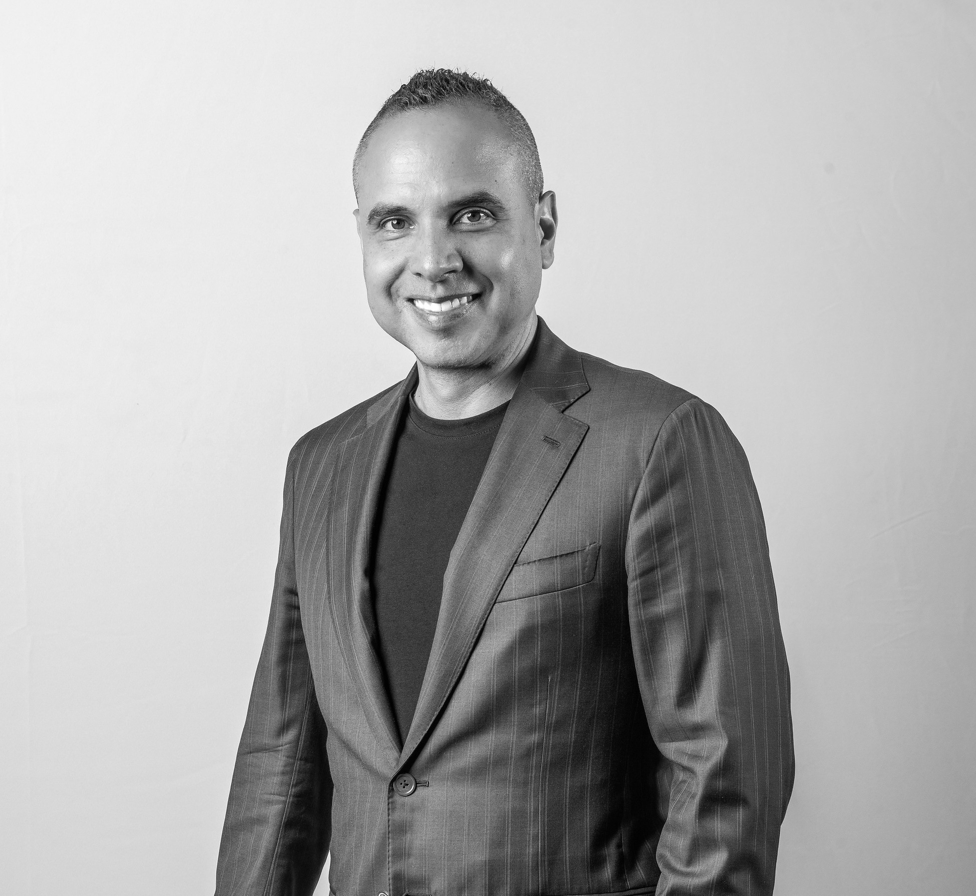 a person smiling at the camera.