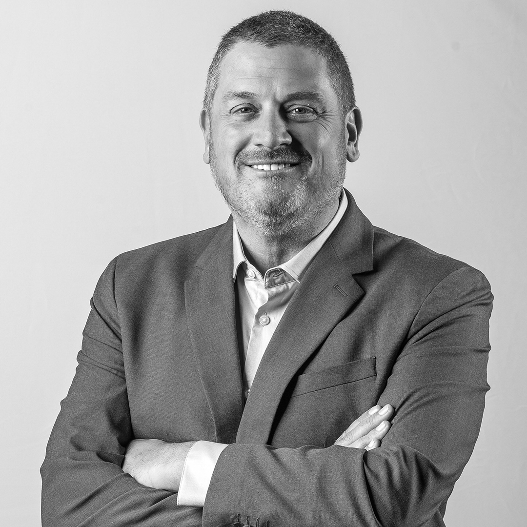 a person smiling at the camera.