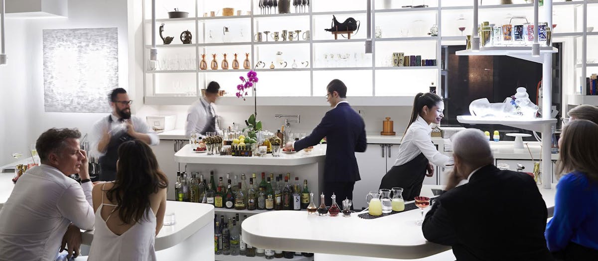 A restaurant scene featuring people seated at tables
