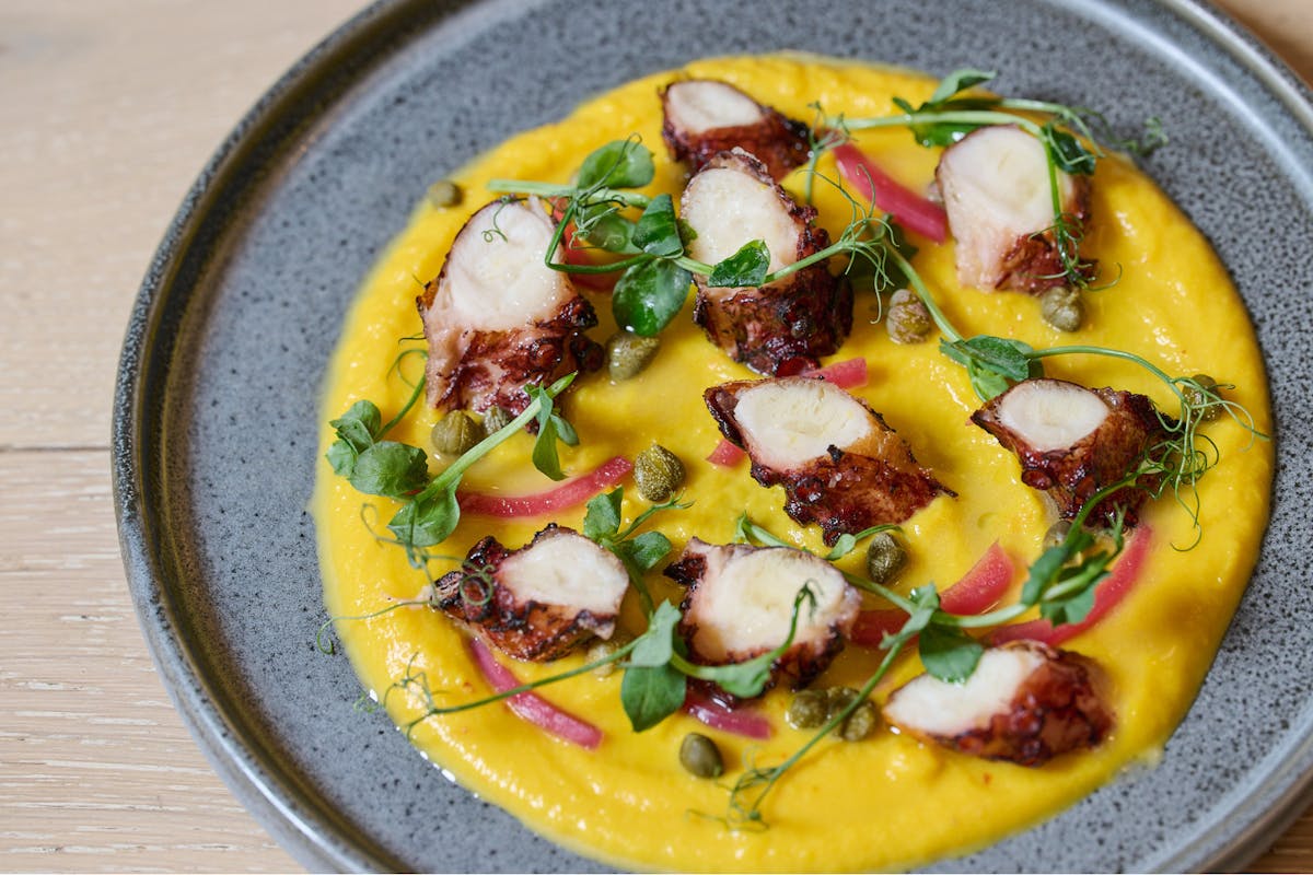 a yellow sauce and meat