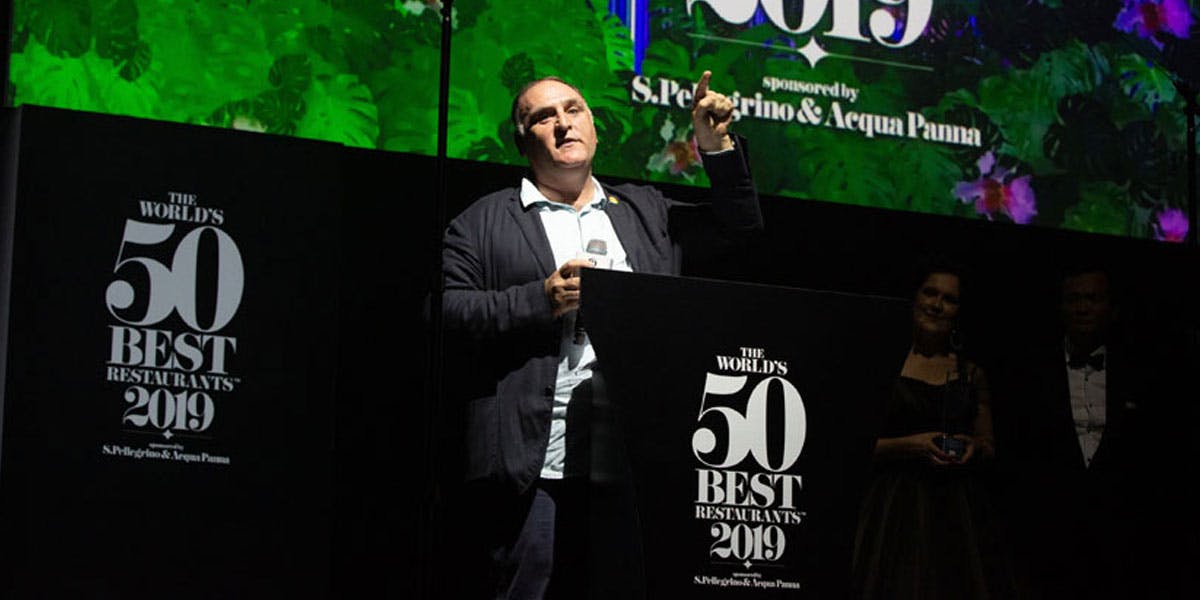 A man stands confidently on stage