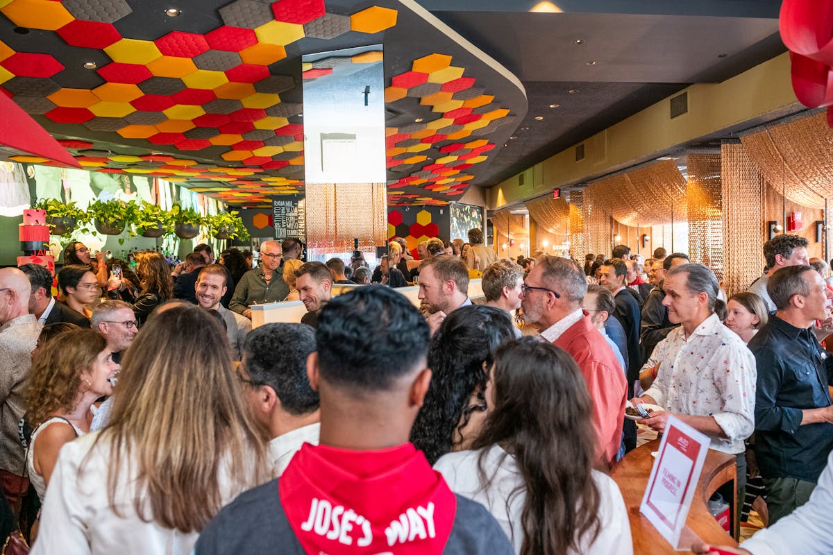 a group of people standing in front of a crowd