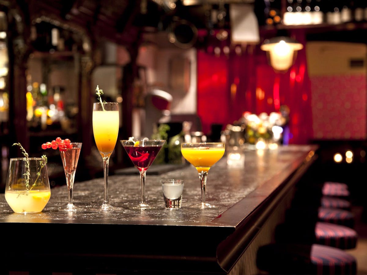 a few glasses on a top of bar