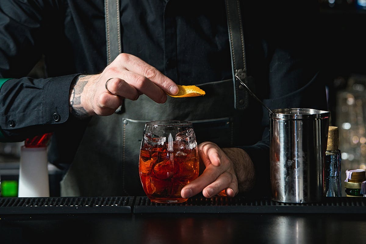 bartender holding a glass