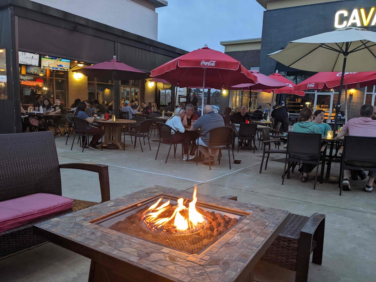 a dining table in front of a building
