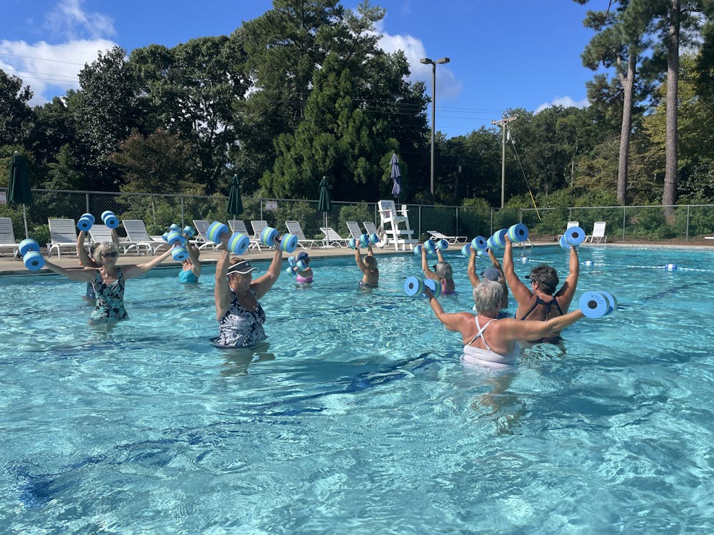 a group of people swimming in the water