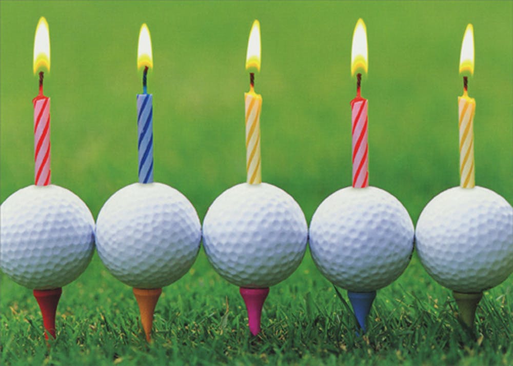 a birthday cake with lit candles