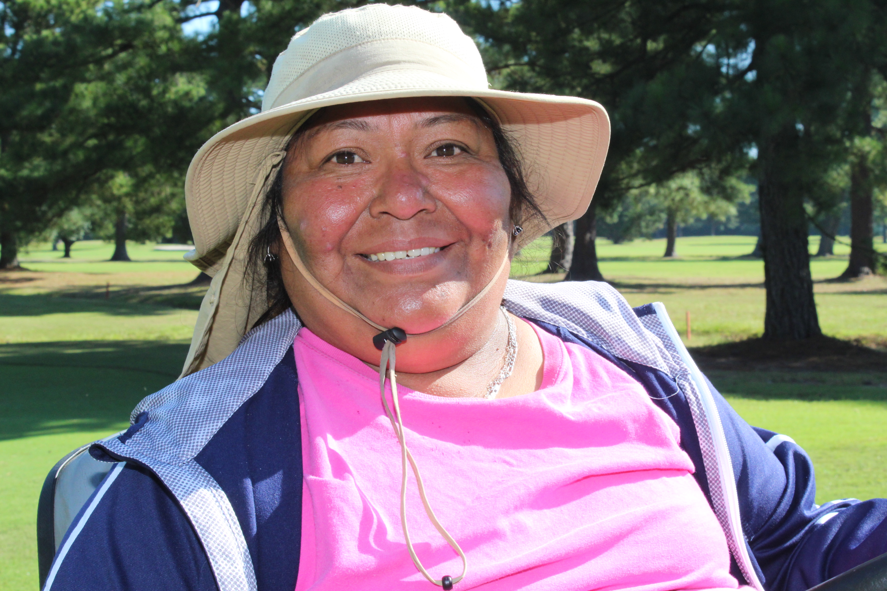 a person wearing a hat and sunglasses
