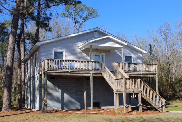 a house with trees in the background