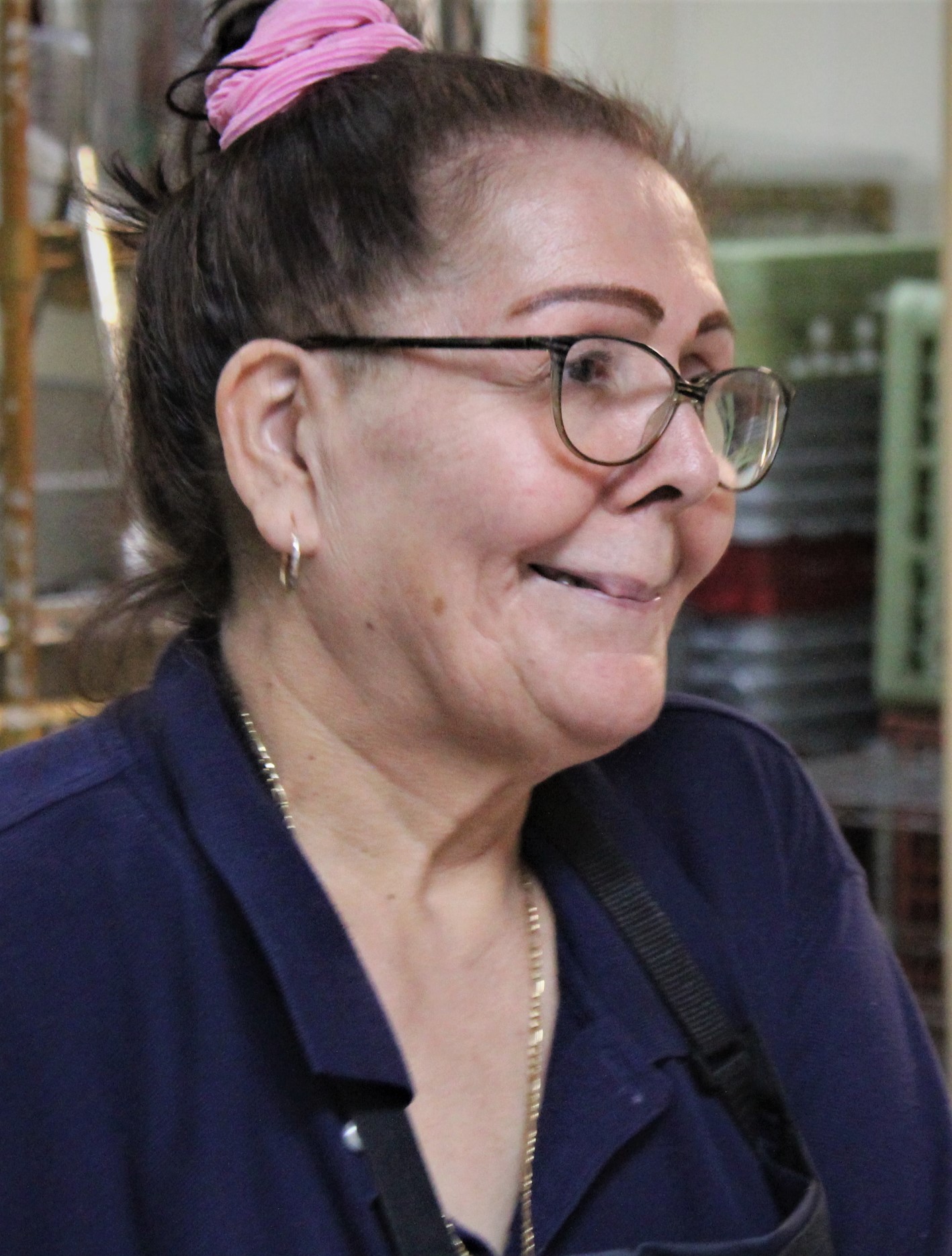 a man wearing glasses and looking at the camera