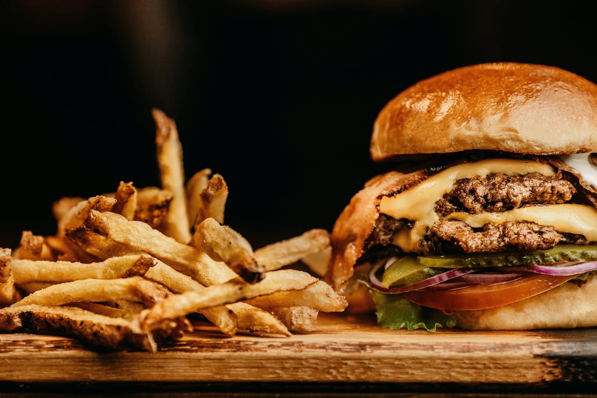 a close up of a sandwich and fries