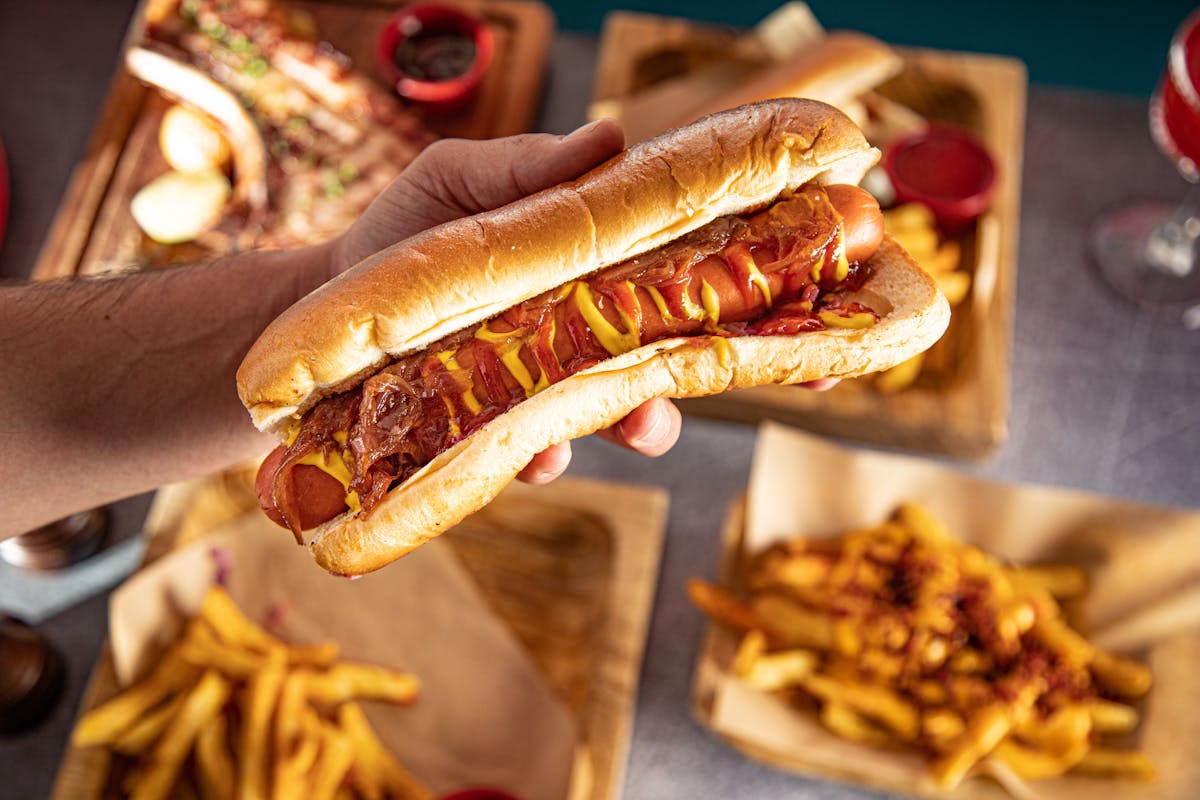 a hot dog and fries on a table