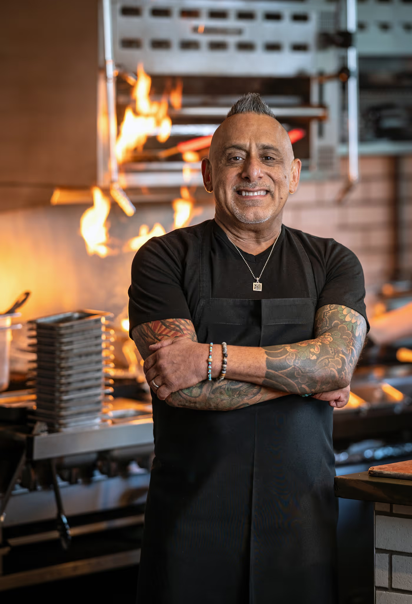 a man with tattoos on his arms