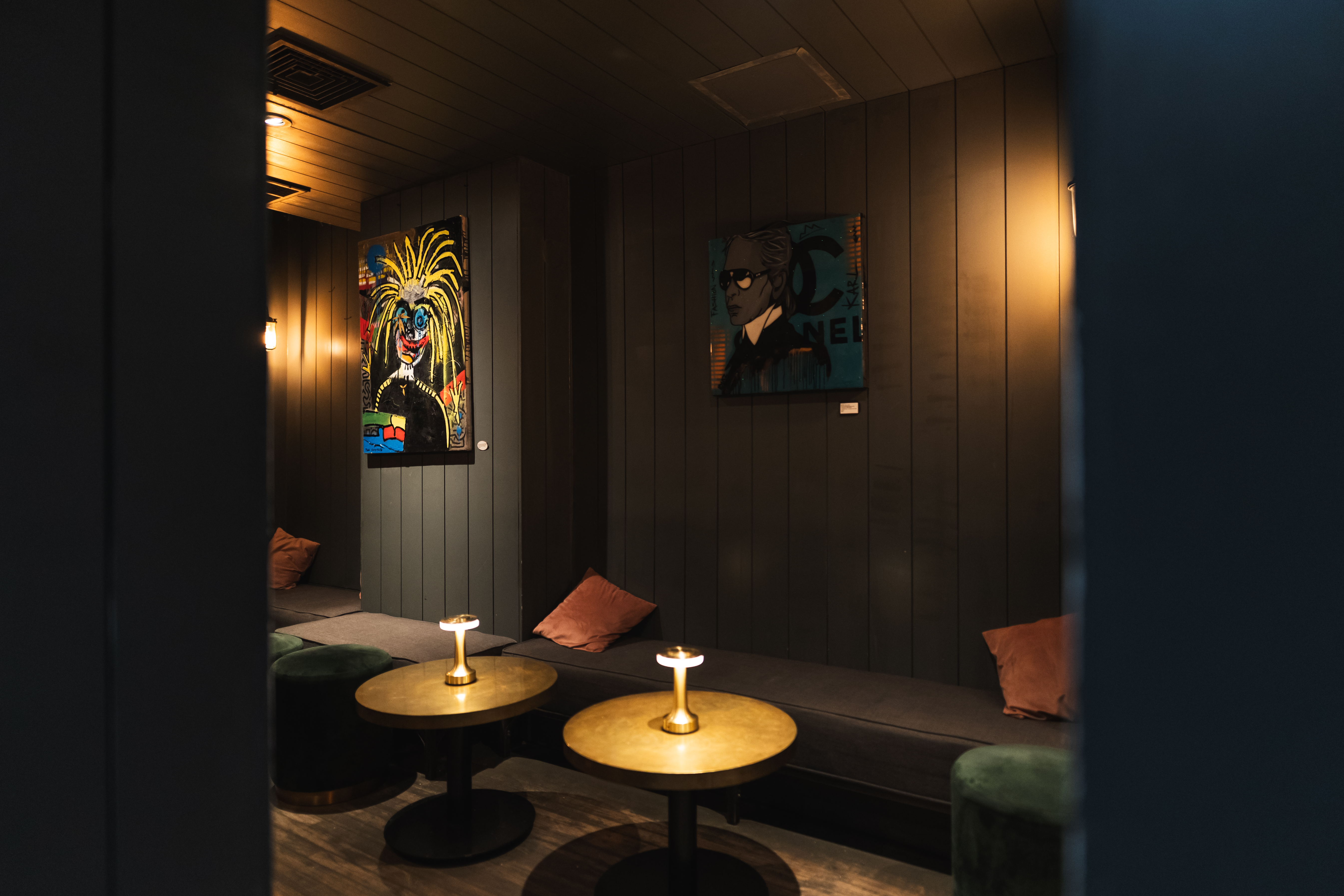 a dark moody lounge inside an upscale bar