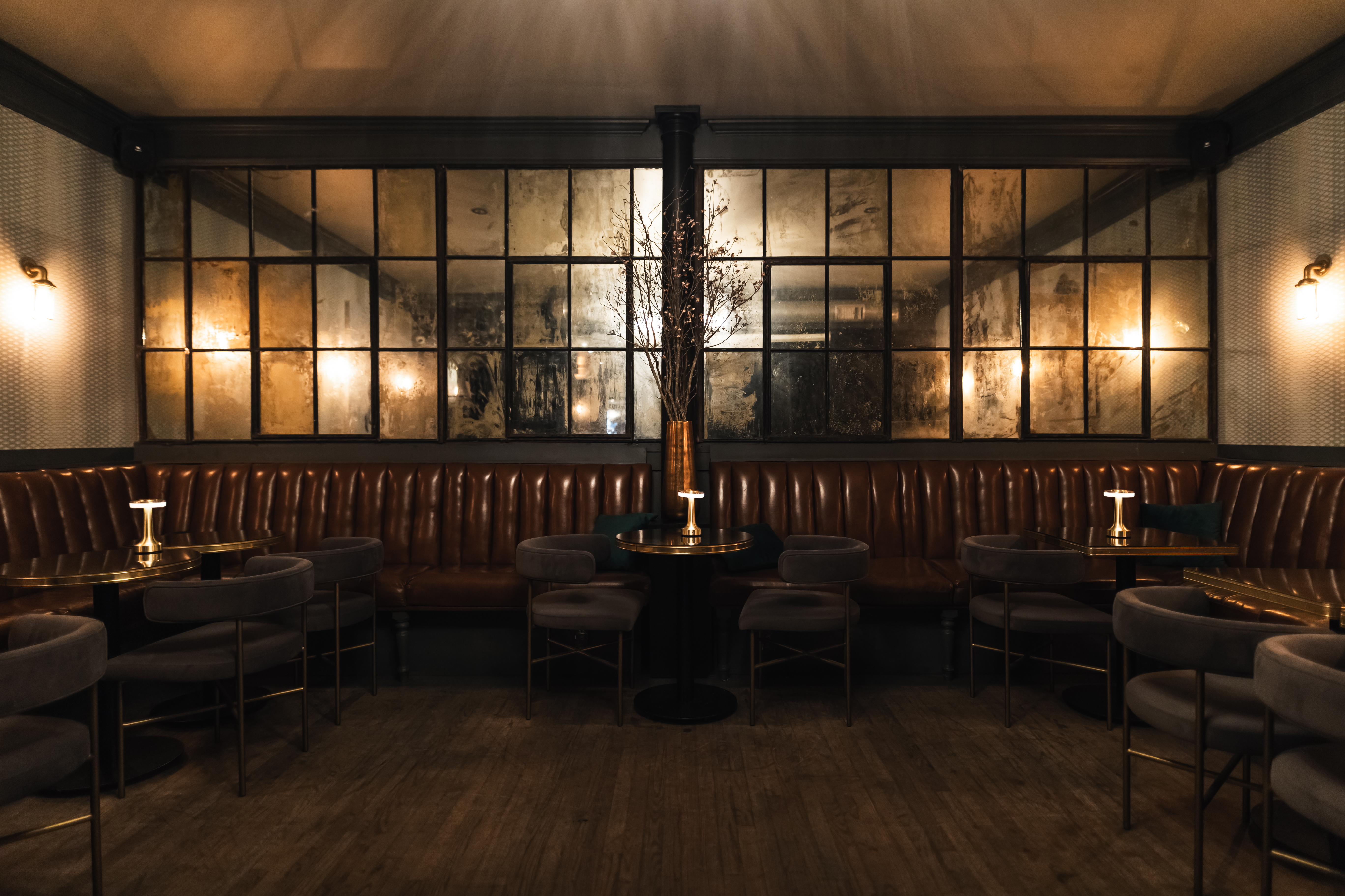 an upscale elegant backroom filled with velvet furniture
