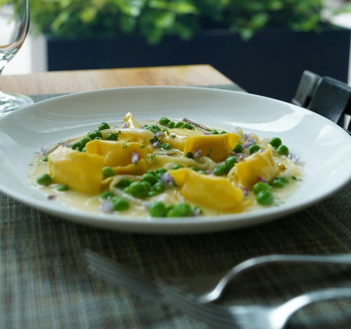 a bowl of food on a plate on a table