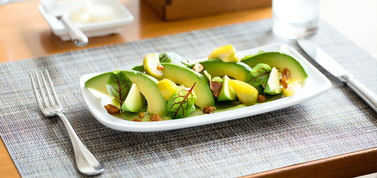 a plate of food sitting on top of a wooden table