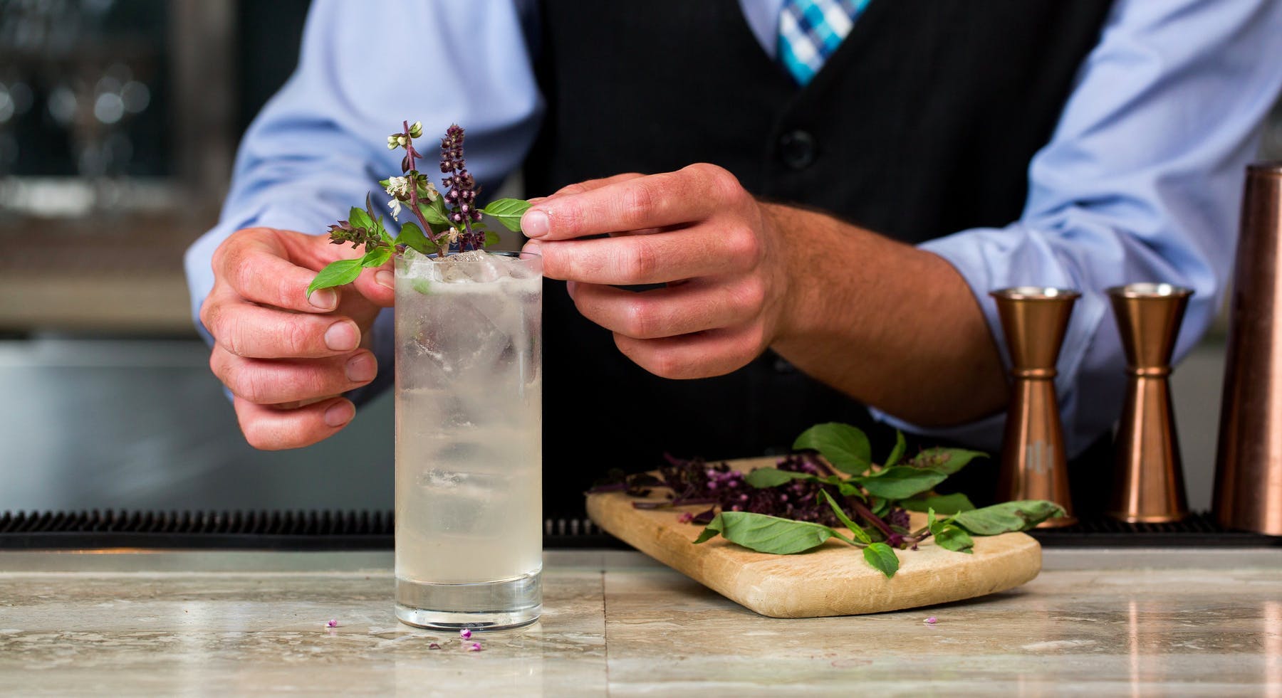 a person preparing a cocktail