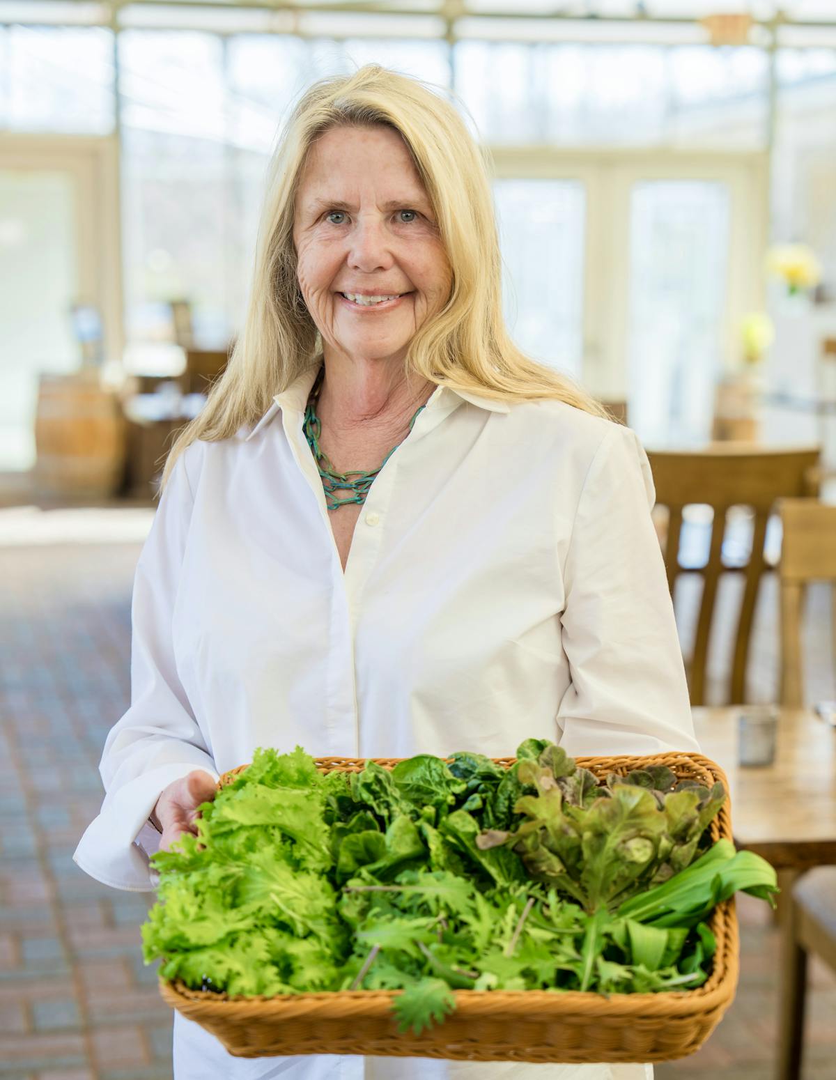 a woman sitting at a table with food