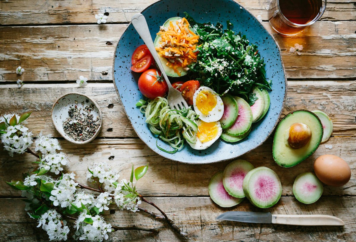 a plate of food sitting on top of a wooden table