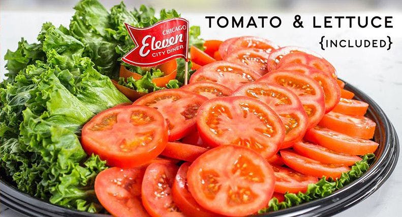 a plate with tomato and lettuce