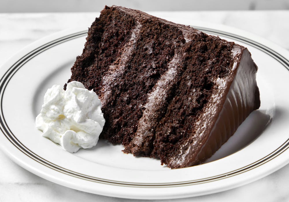 a piece of cake and ice cream on a plate