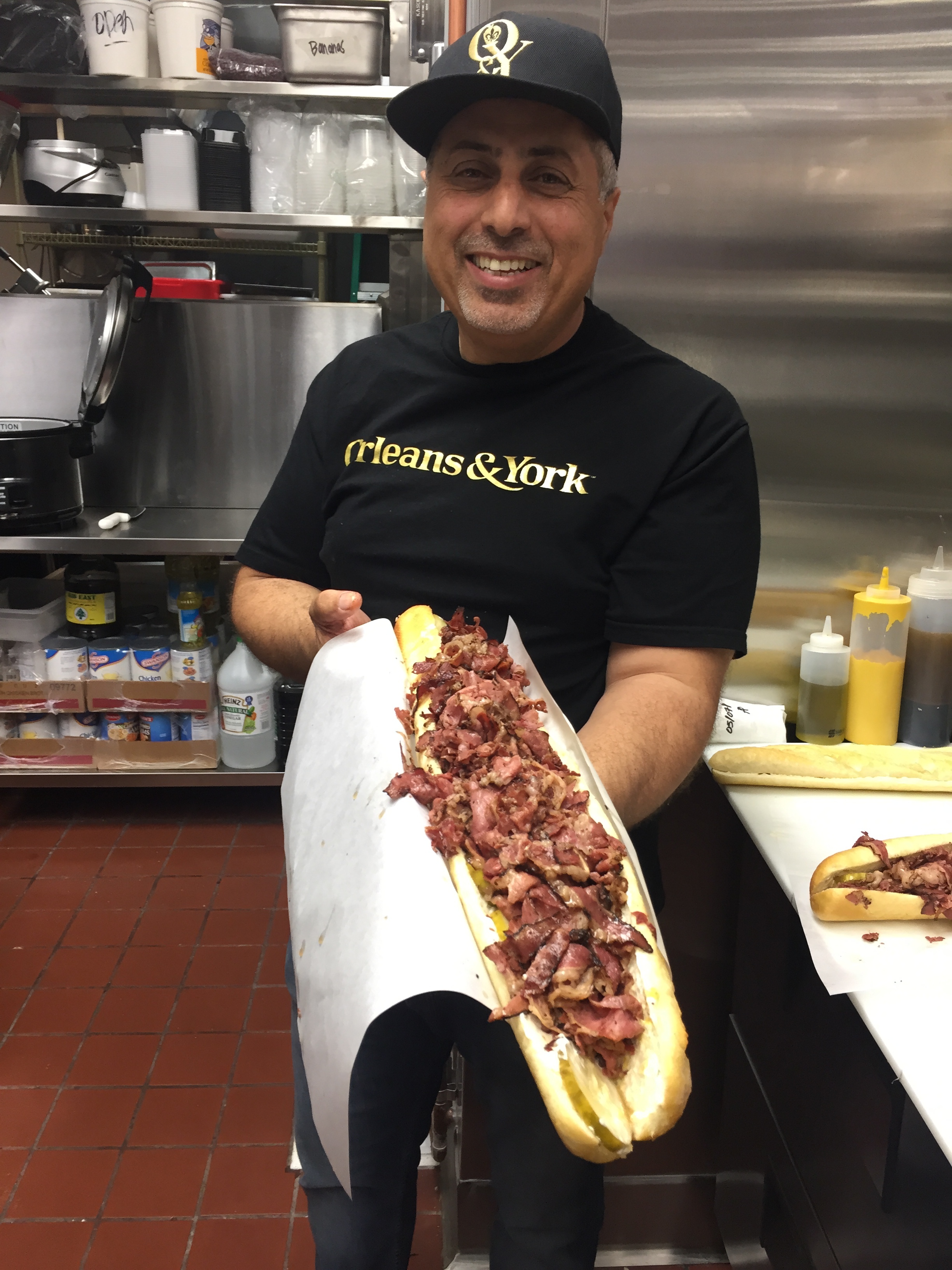 a person holding a hot dog