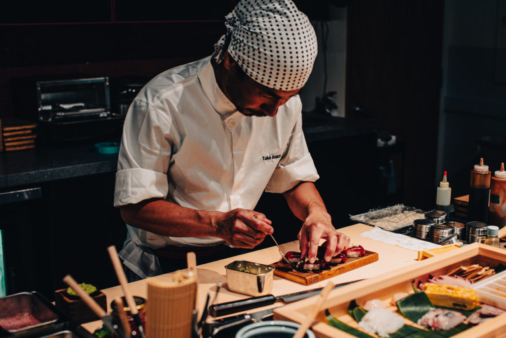 a man preparing food in a kitchen