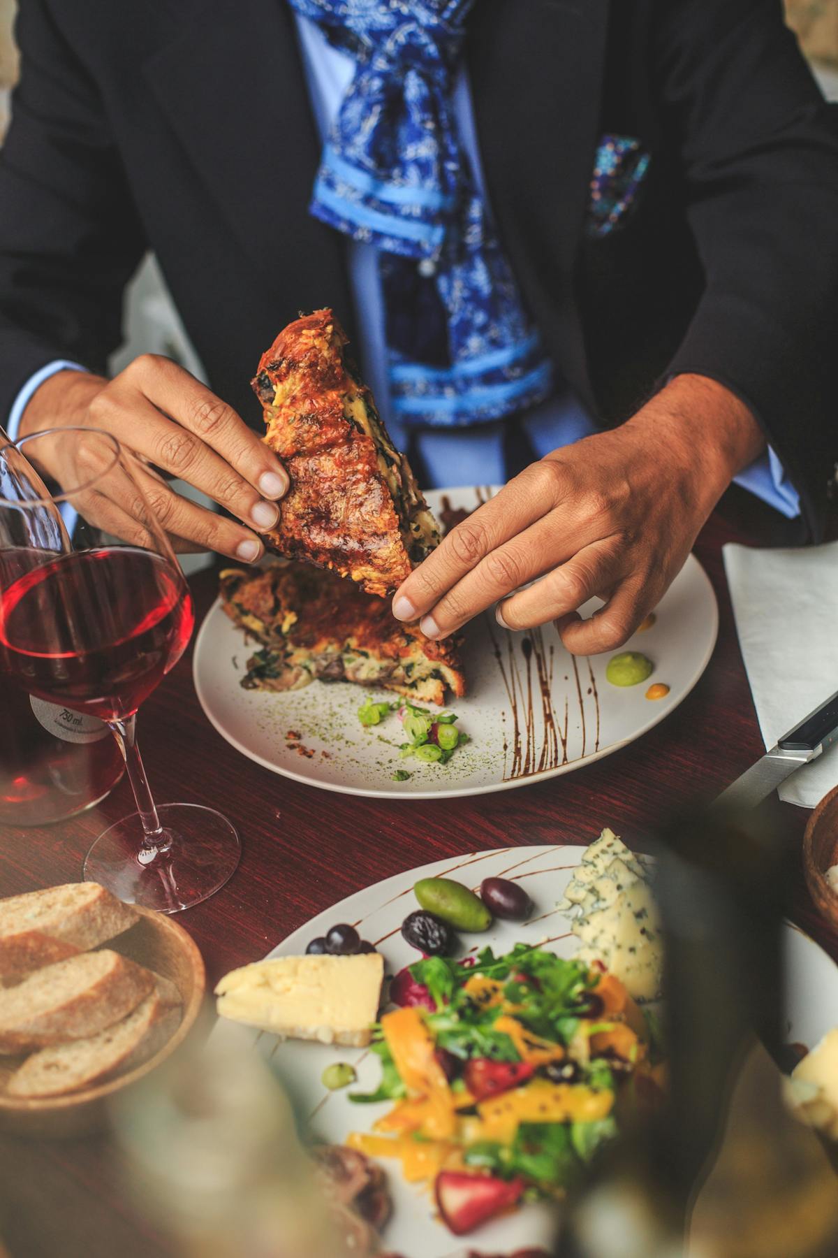 a group of people sitting at a table with a plate of food