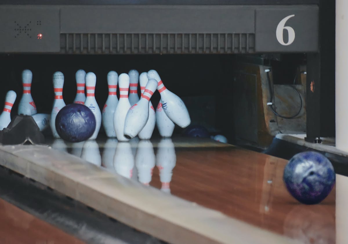 bowling pins knocked over by a bowling ball