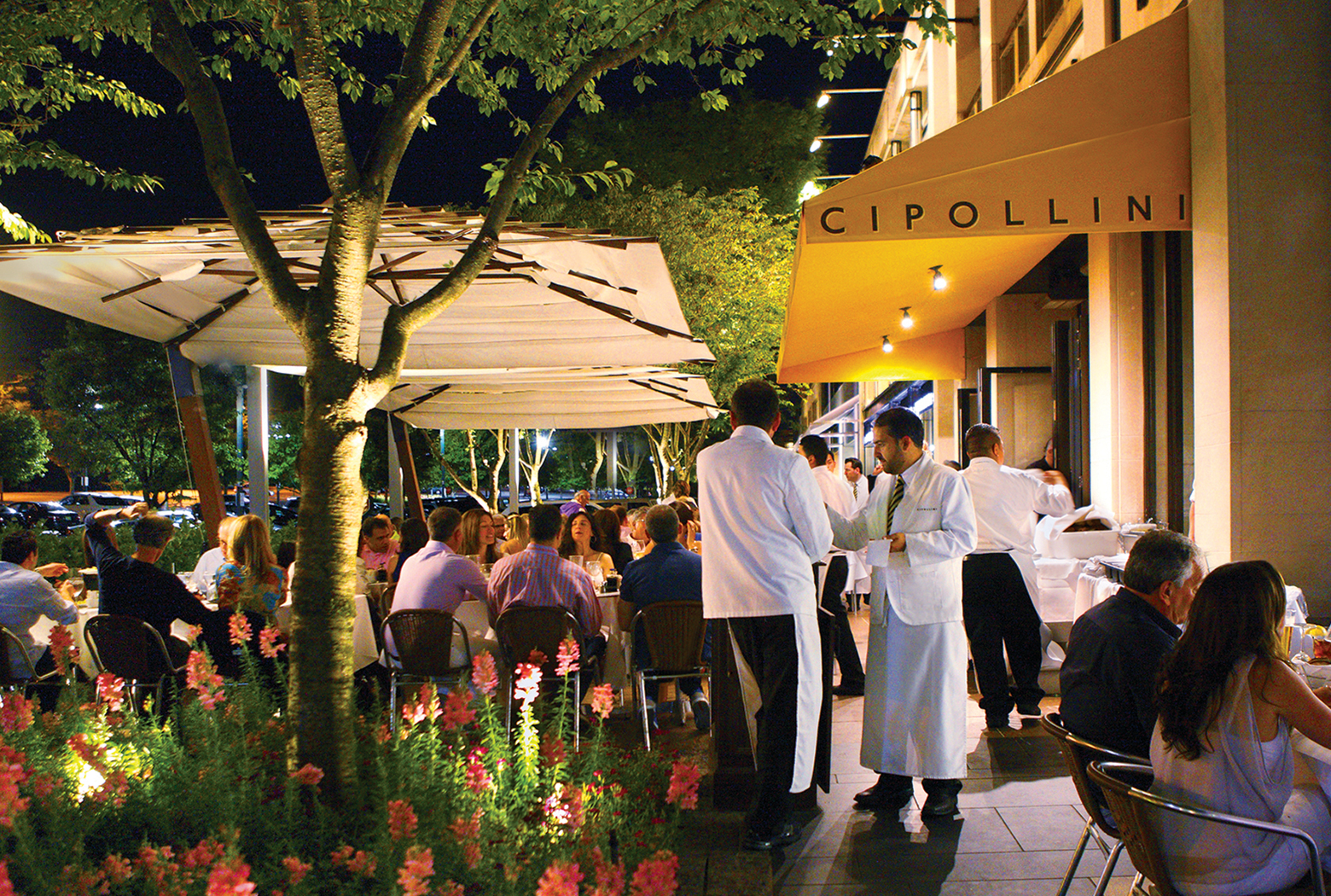 a group of people standing in front of a building